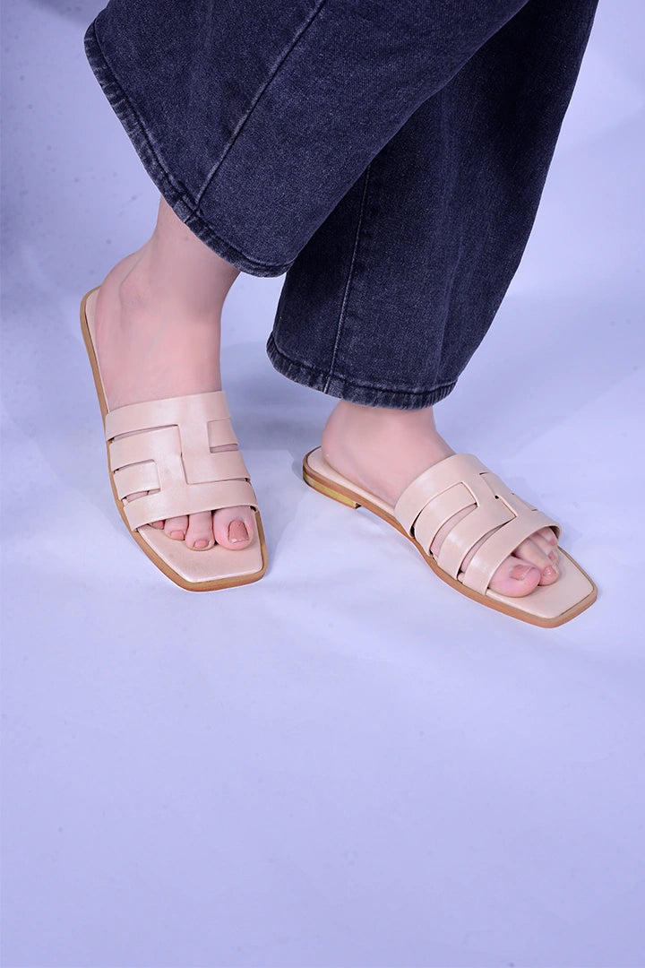 Stylish and comfy beige flats with a modern cutout pattern. 