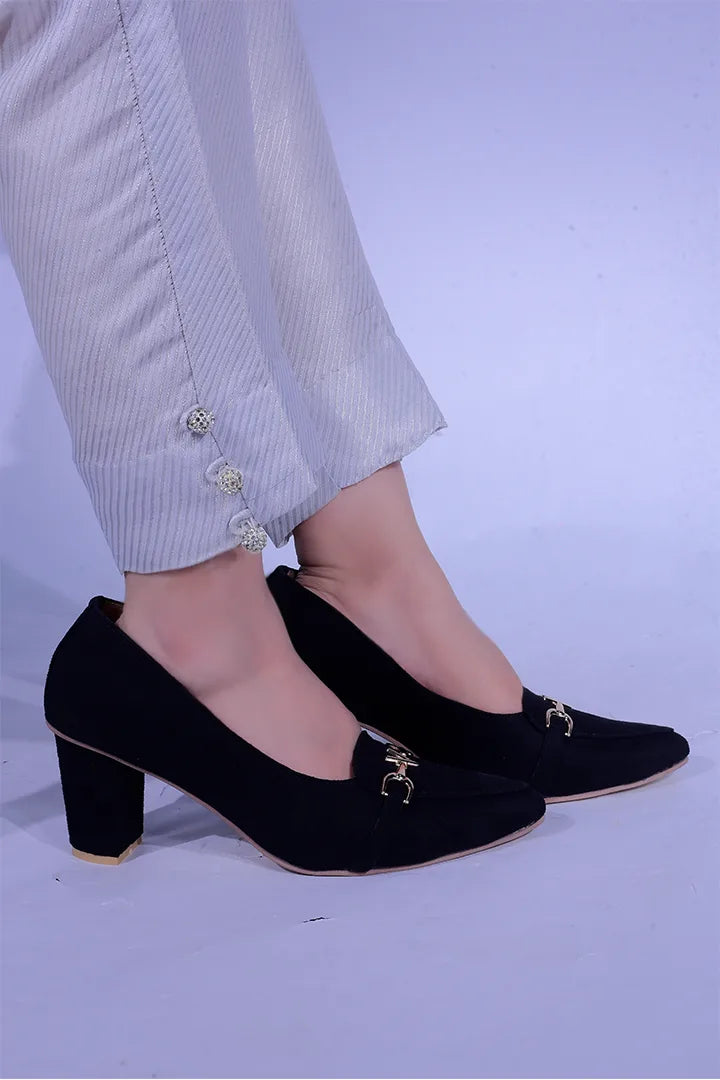 Black pointed-toe block heels with gold detail.